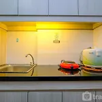 Modern Style Studio Apartment At Azalea Suites With City View By Travelio